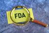 Magnifying glass on FDA sign