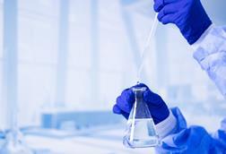 A,Scientist,Is,Holding,A,Beaker,Filled,With,Water.,Concept