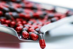 Red,And,Gray,Capsule,Pills,On,Stainless,Steel,Drug,Tray