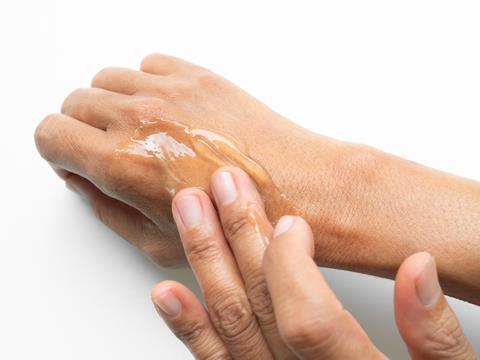person applying gel onto hand